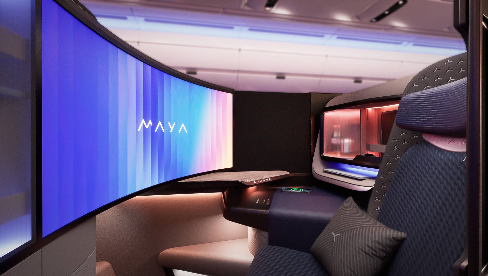 MAYA seat from collins and panasonic. Large curved screen and business class seat. Screen displays the MAYA logo